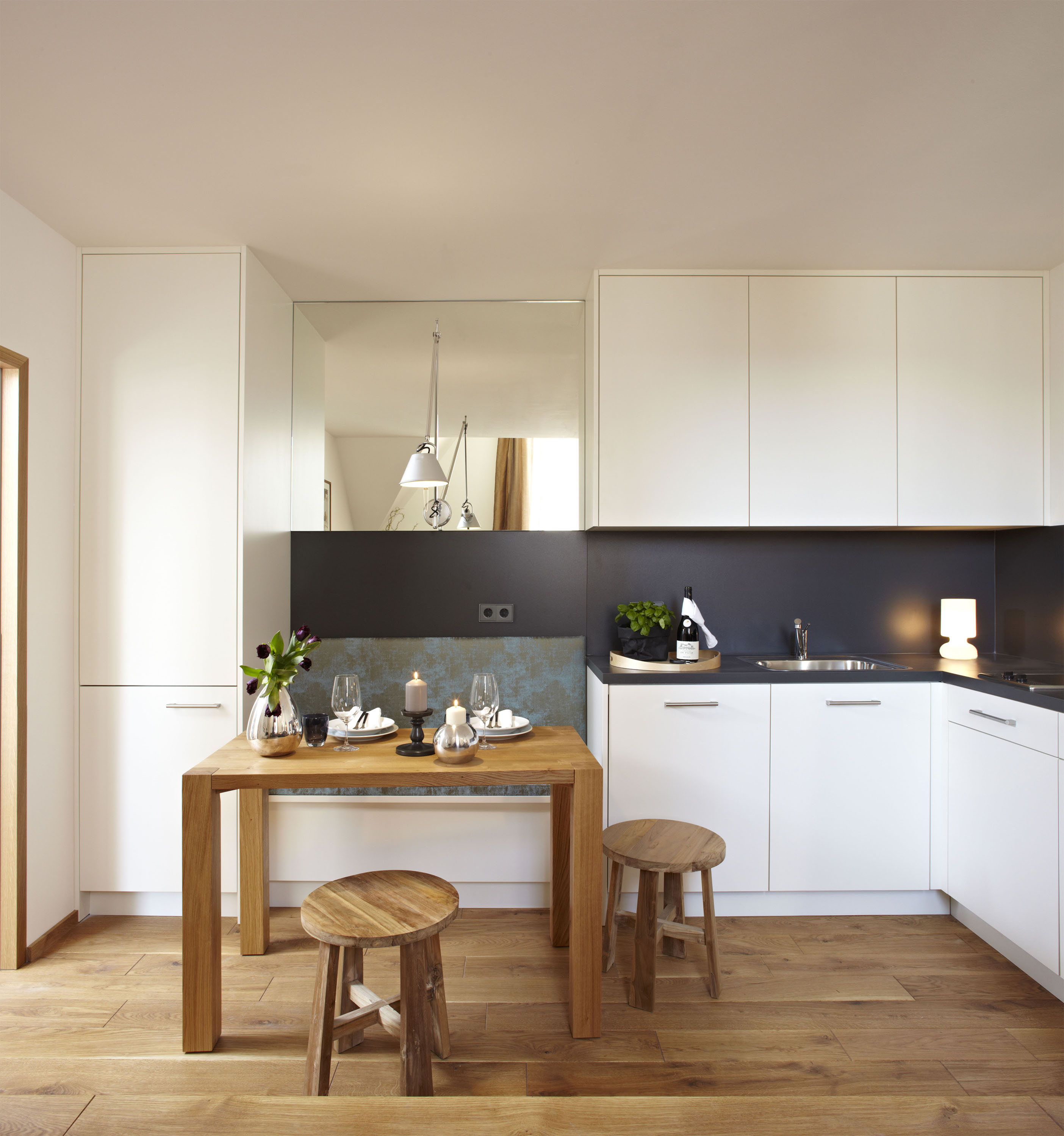 Apartment 4 — kitchen with custom cabinetry and mirror