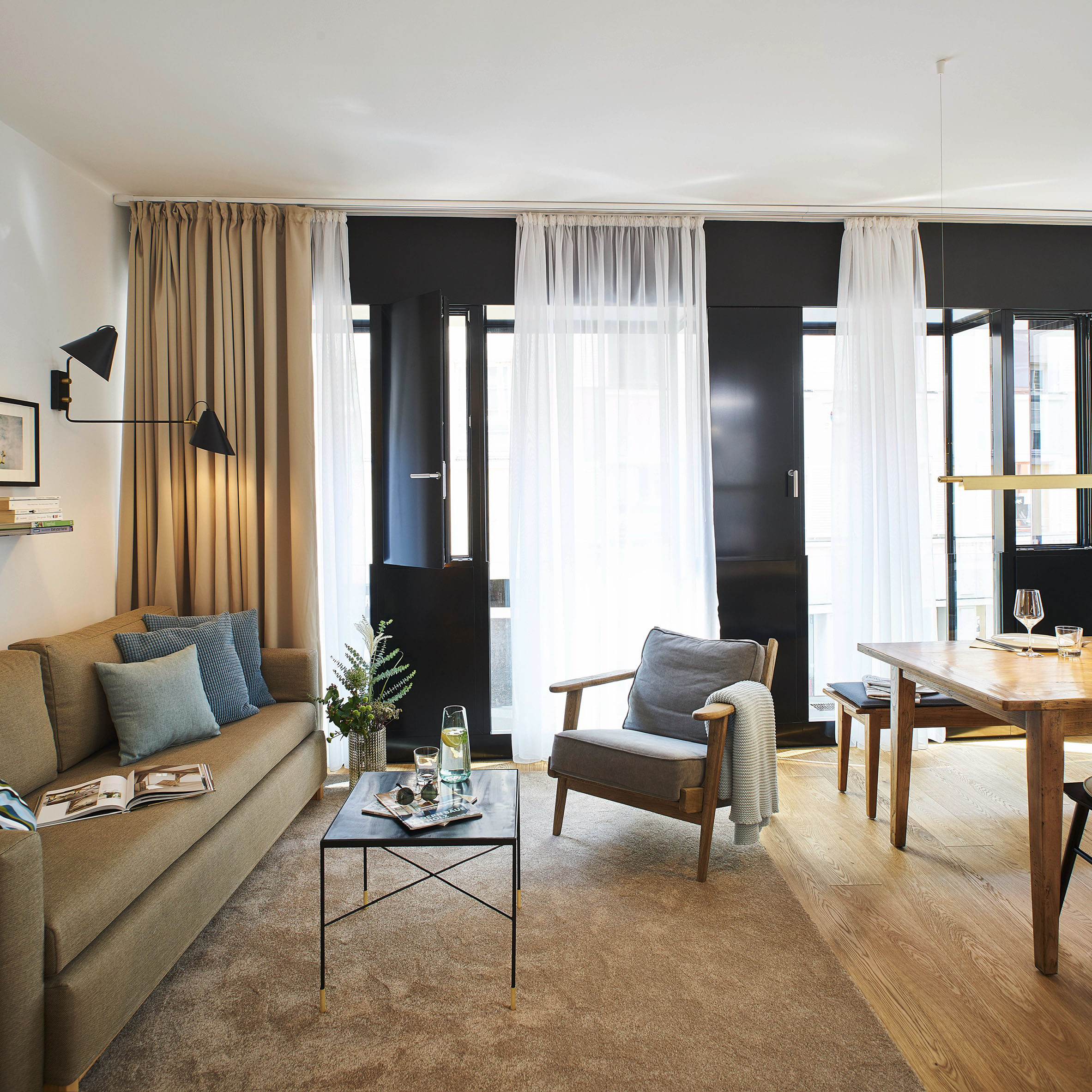 Apartment 8 — living room with black steel window wall