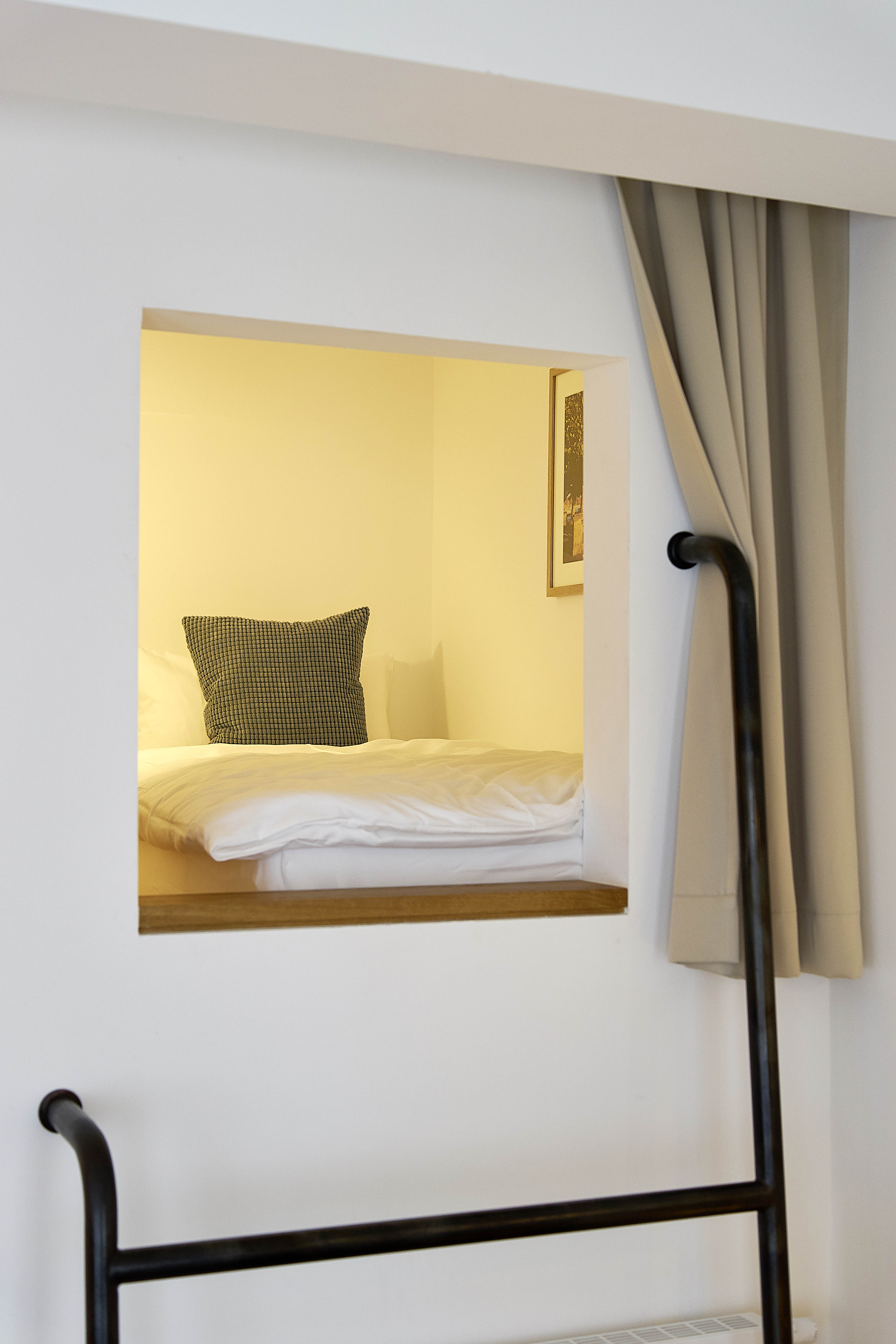 Apartment 8 — sleeping nook above the entrance staircase