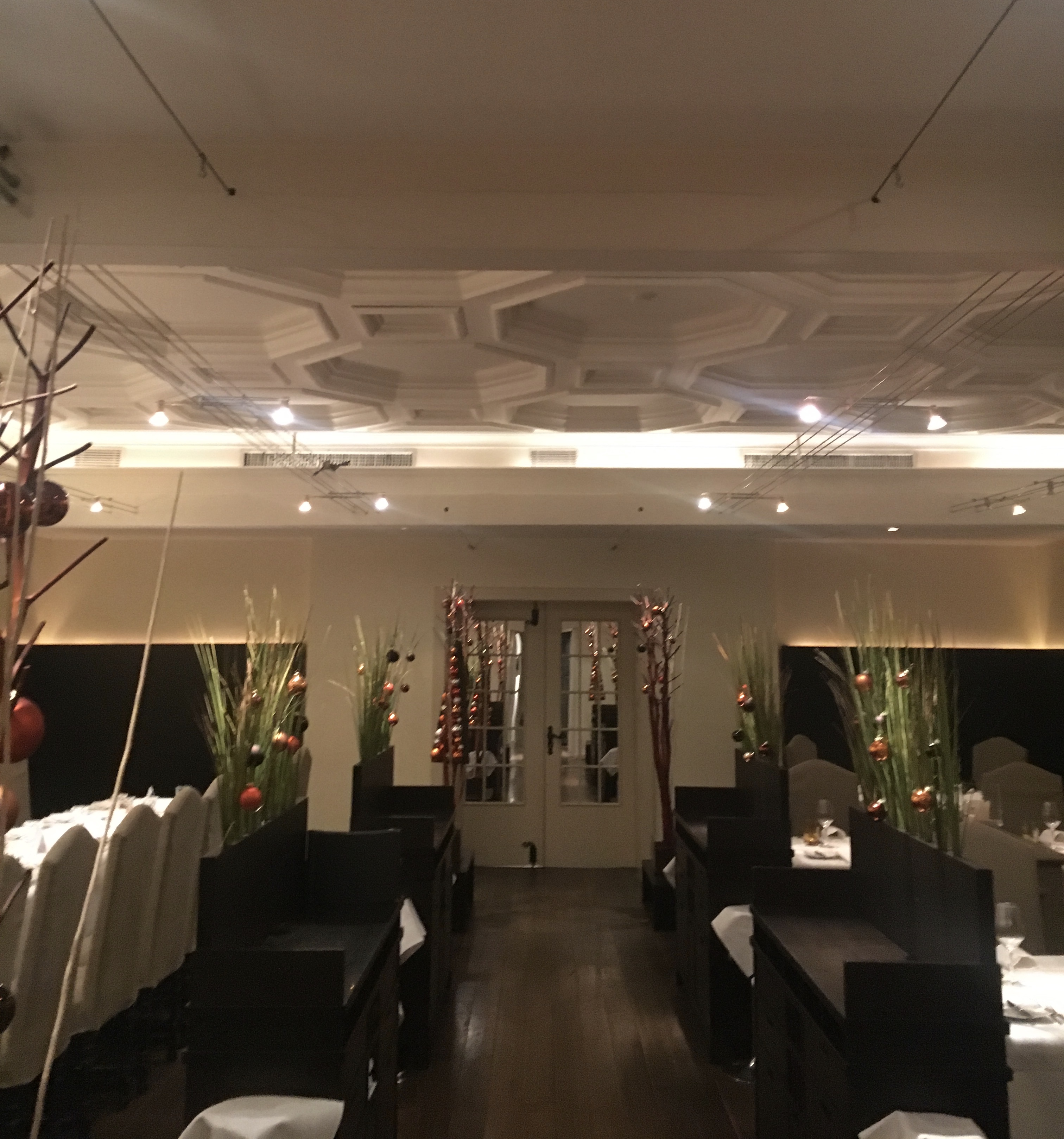 Restaurant before — suspended ceiling, track lighting