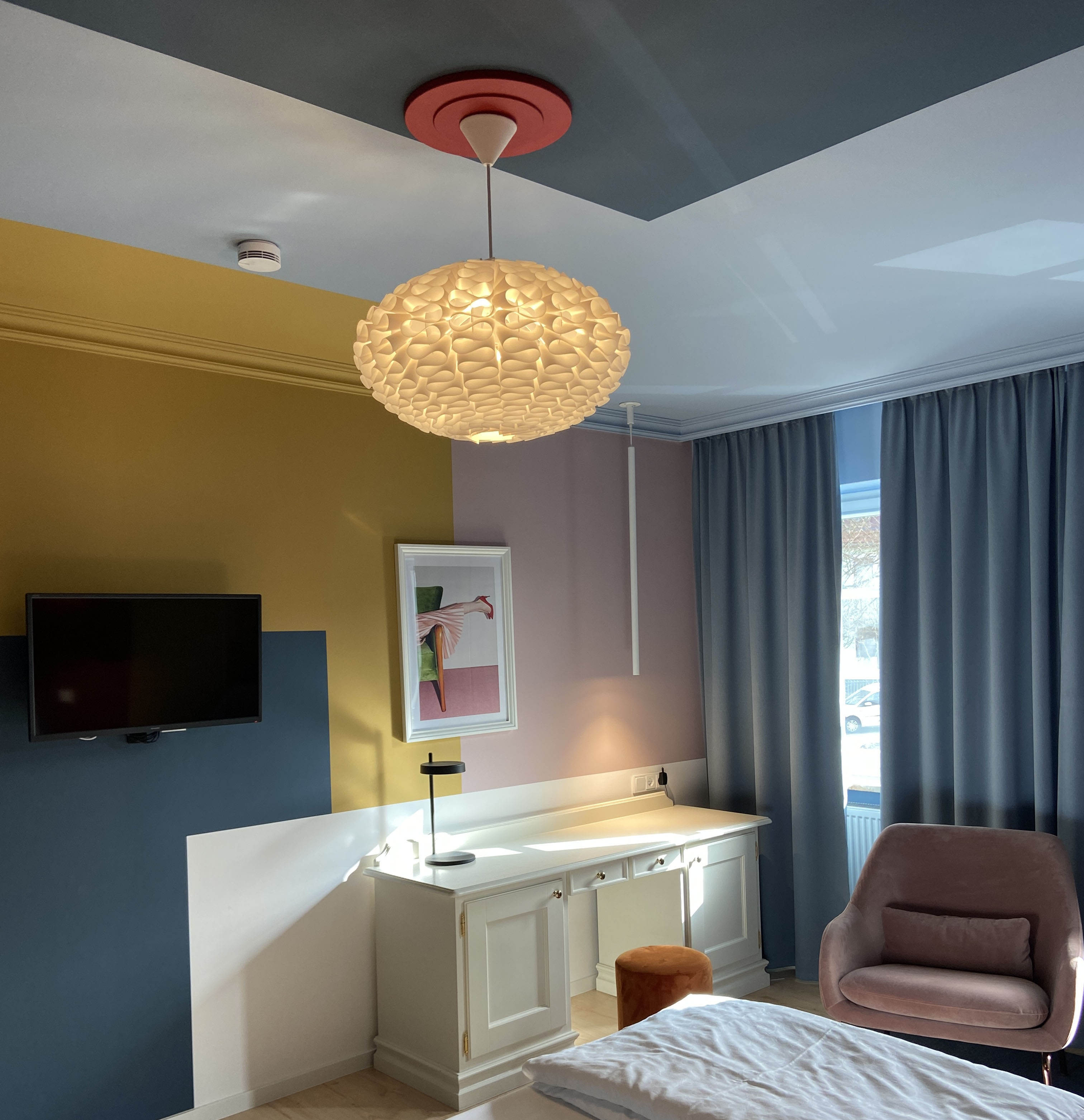 Mustard, blue, and pink colour-block room