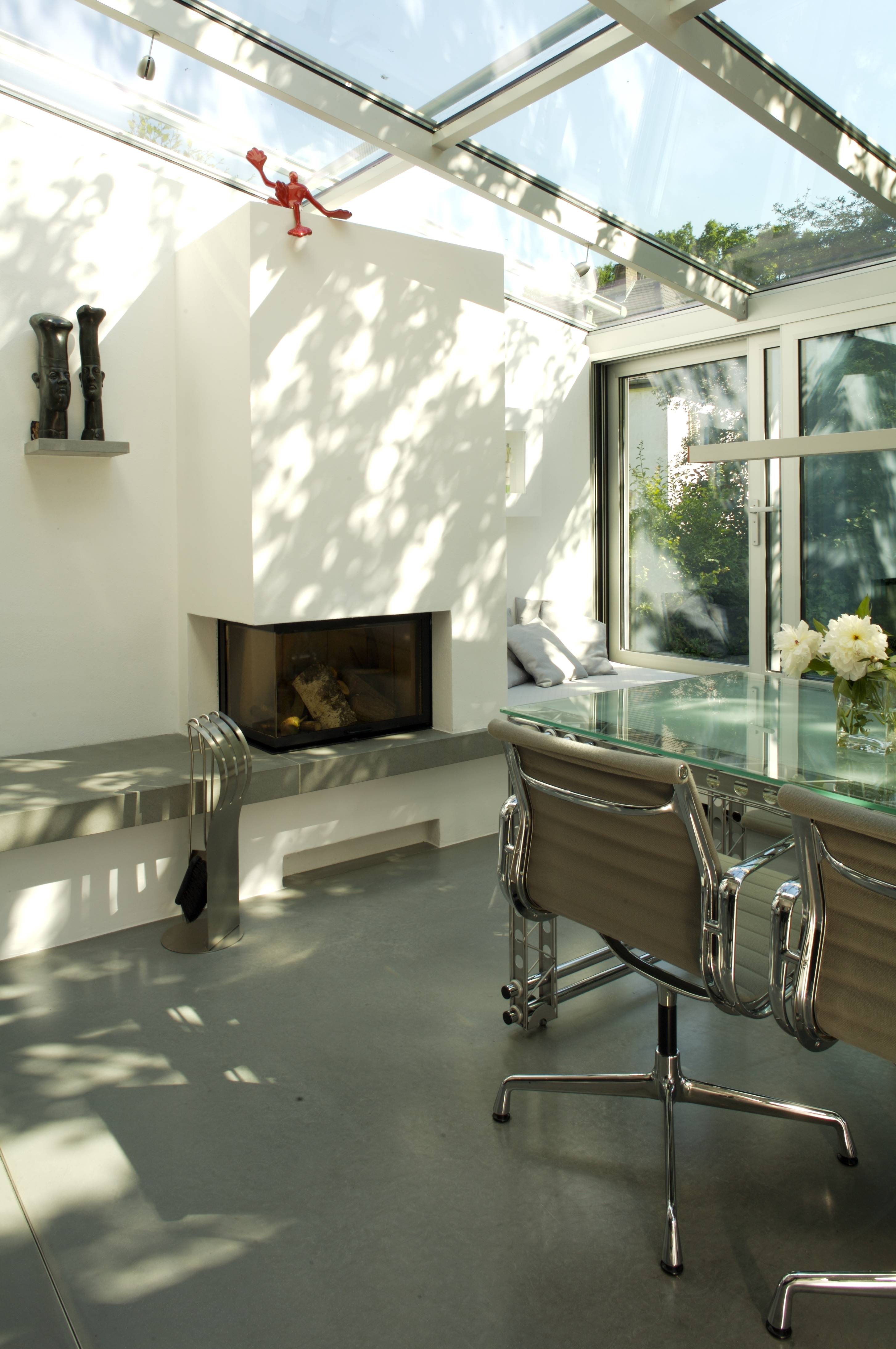 Fireplace — white chimney breast, two-sided firebox, garden beyond