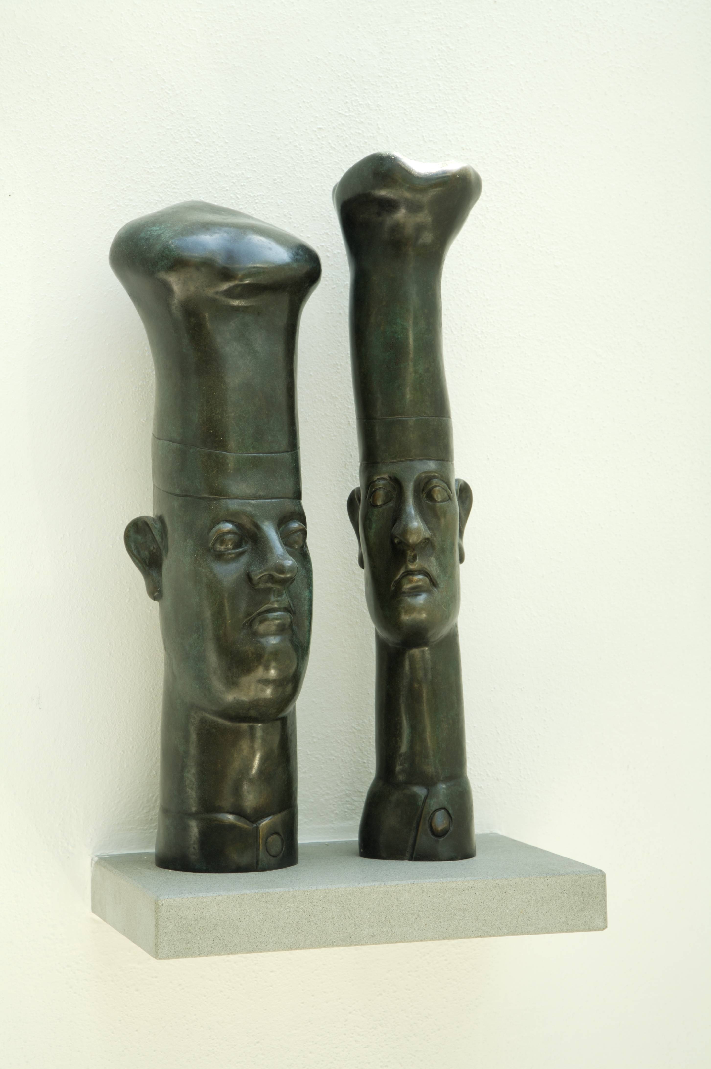 Two bronze sculptures by Günter Grass on the fireplace shelf
