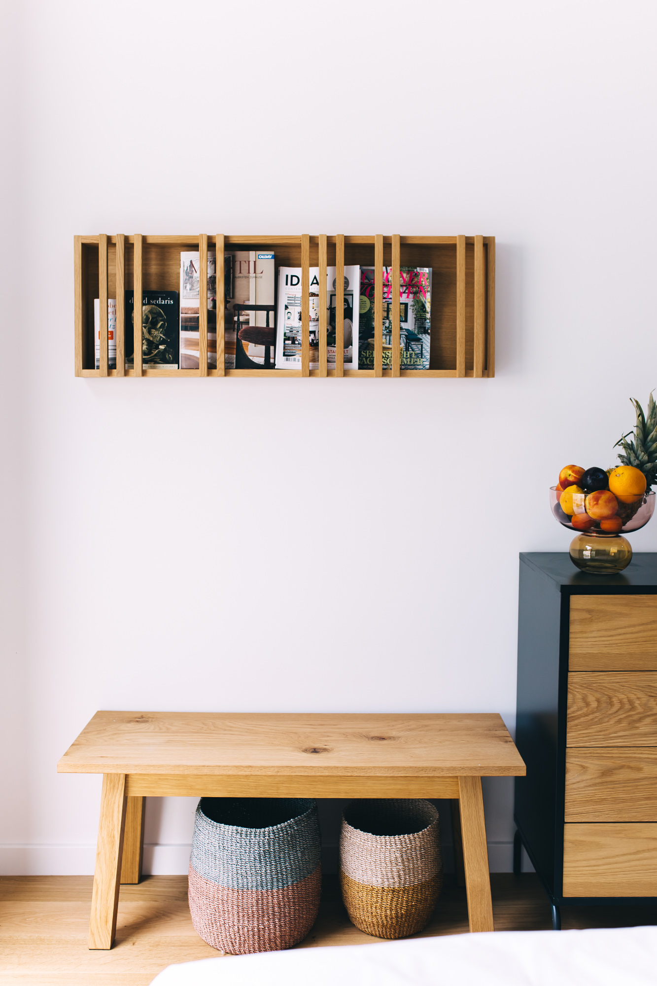 Bedroom detail — curated shelf, bench, accessories