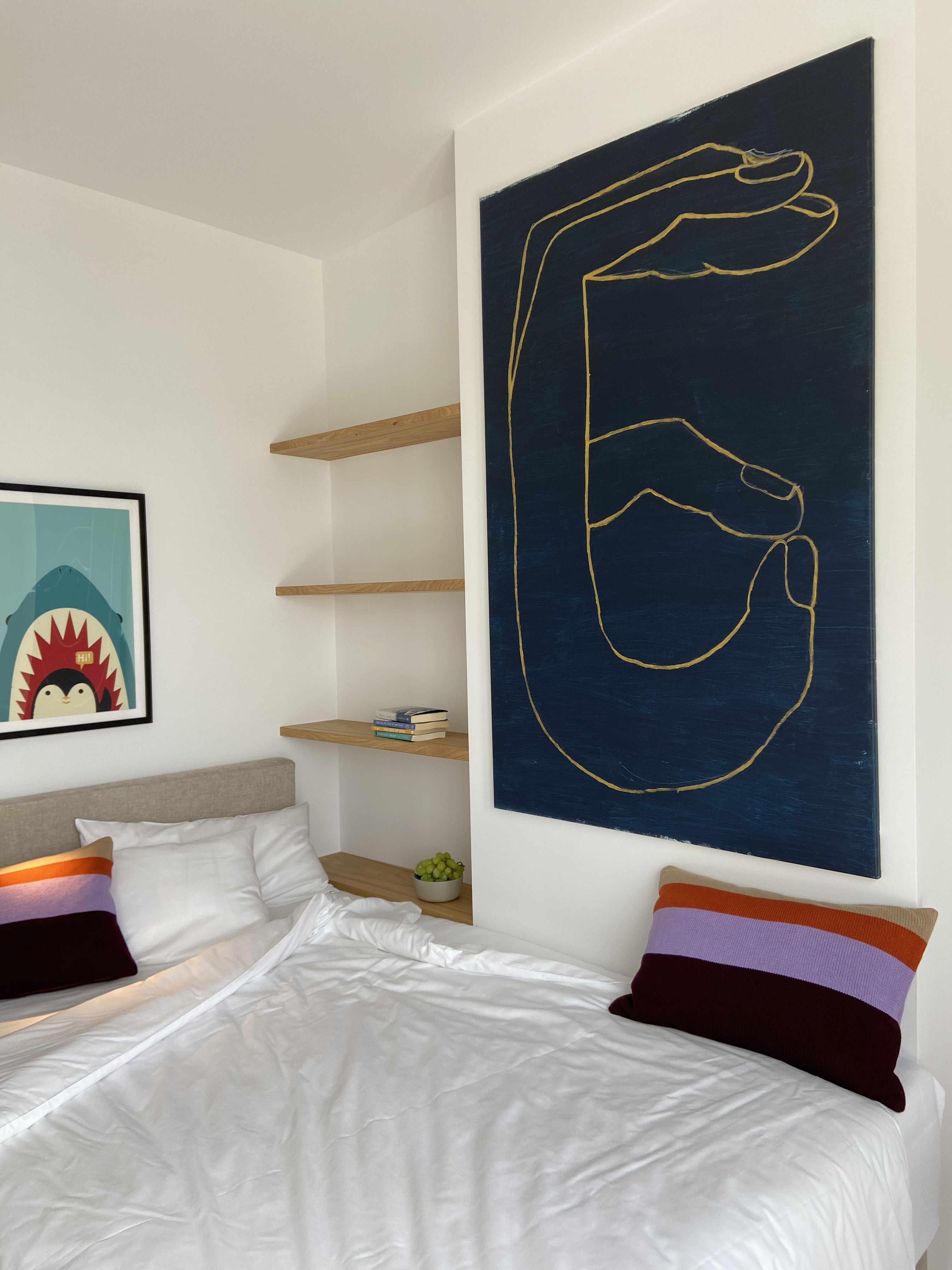 Bedroom — round mirror, bedside light, garden glimpse